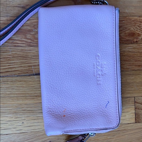 ⚡️ 2/$15 Light pink coach wristlet (pen damage) - Picture 1 of 1